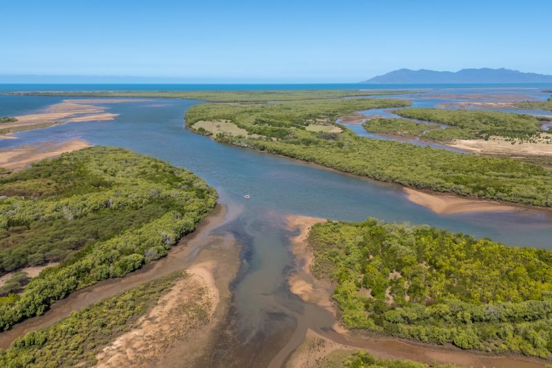 An aerial view of the Burdekin River approaching the Queensland coastline